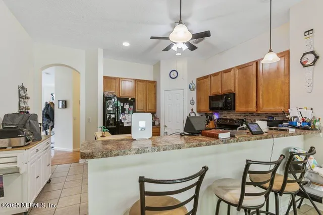 a kitchen with a dining table and chairs
