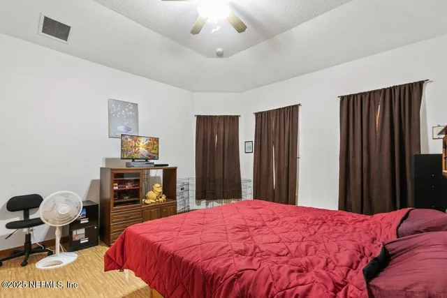 a bed room with a bed and a chair