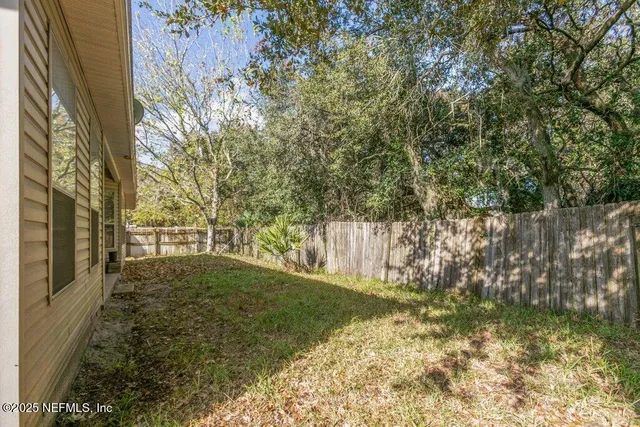 a view of yard with trees