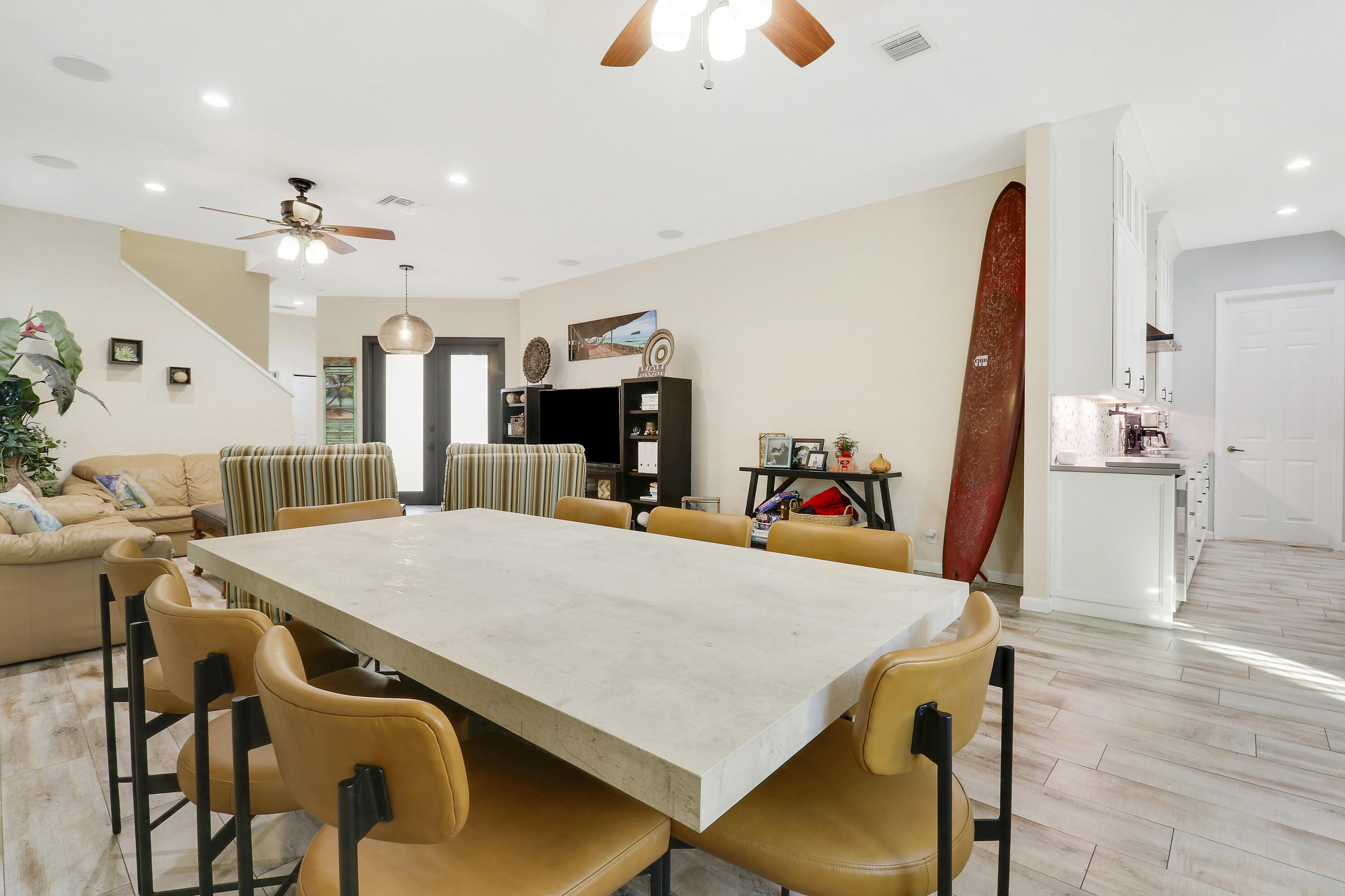 104 Via Azurra Jupiter, FL 33458 - Photo 18 of 41 a view of a dining room with furniture and wooden floor