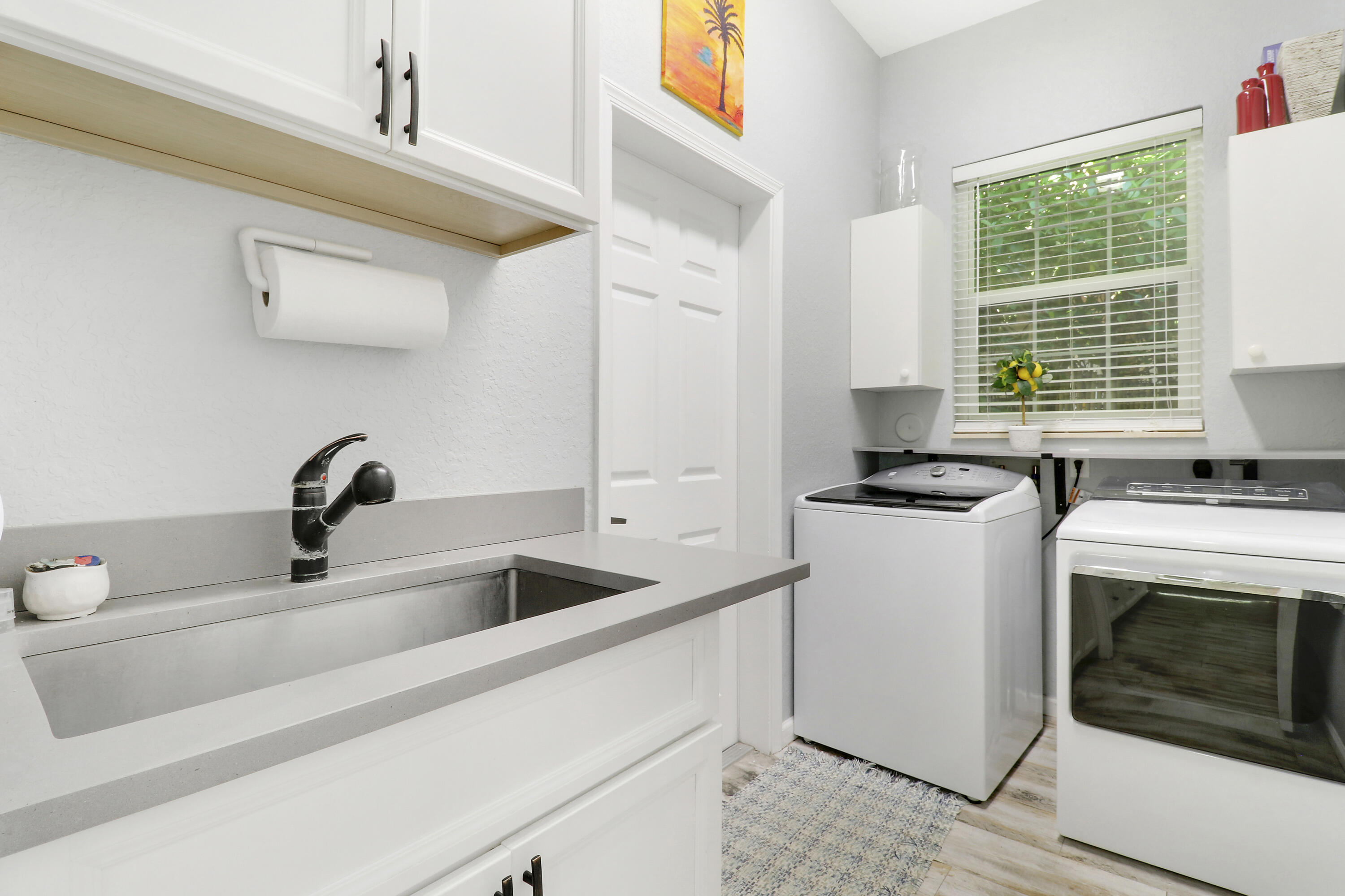 104 Via Azurra Jupiter, FL 33458 - Photo 25 of 41 Laundry Room off Kitchen