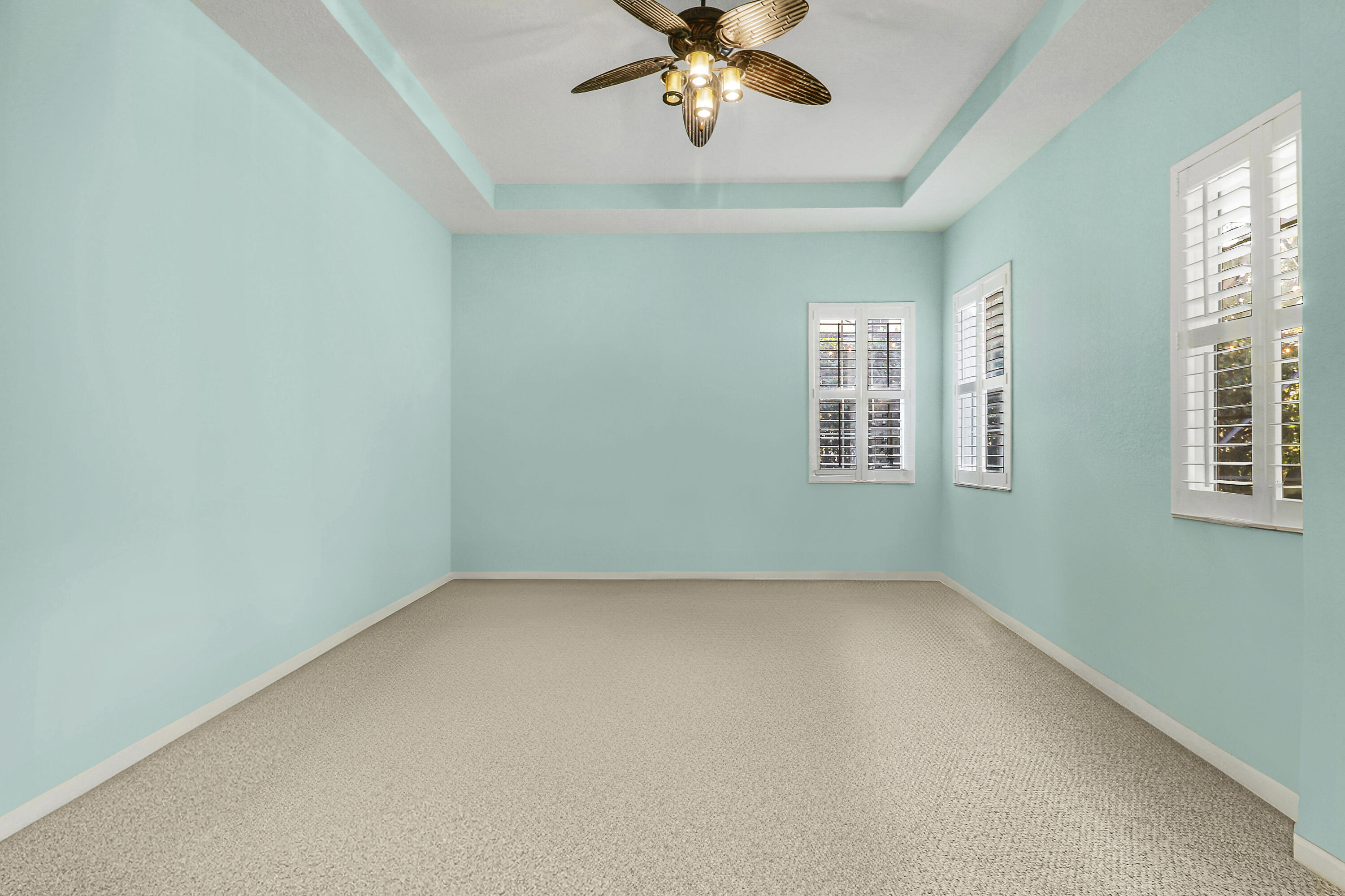 104 Via Azurra Jupiter, FL 33458 - Photo 26 of 41 an empty room with windows and fan