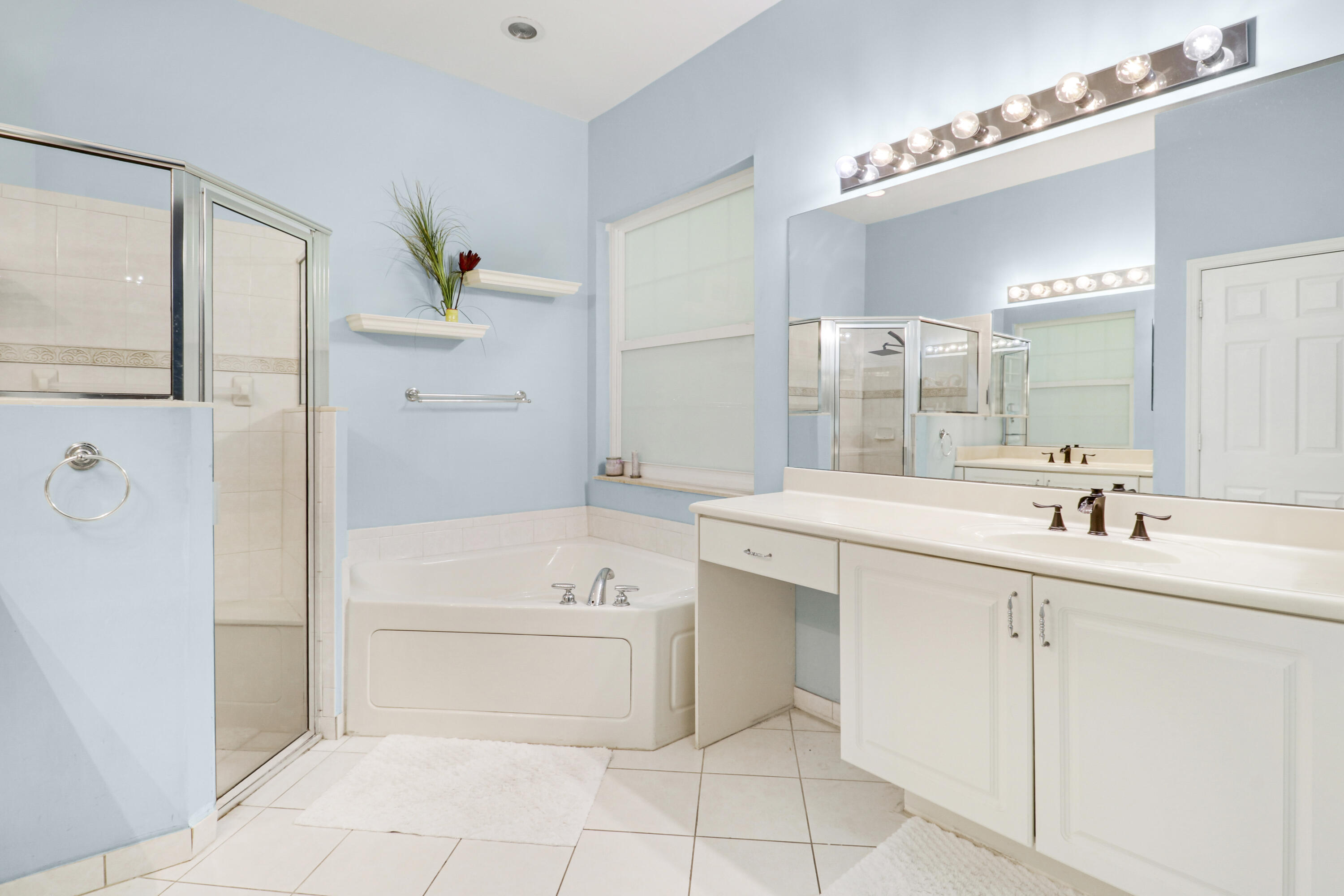 104 Via Azurra Jupiter, FL 33458 - Photo 29 of 41 a bathroom with a sink a toilet and shower