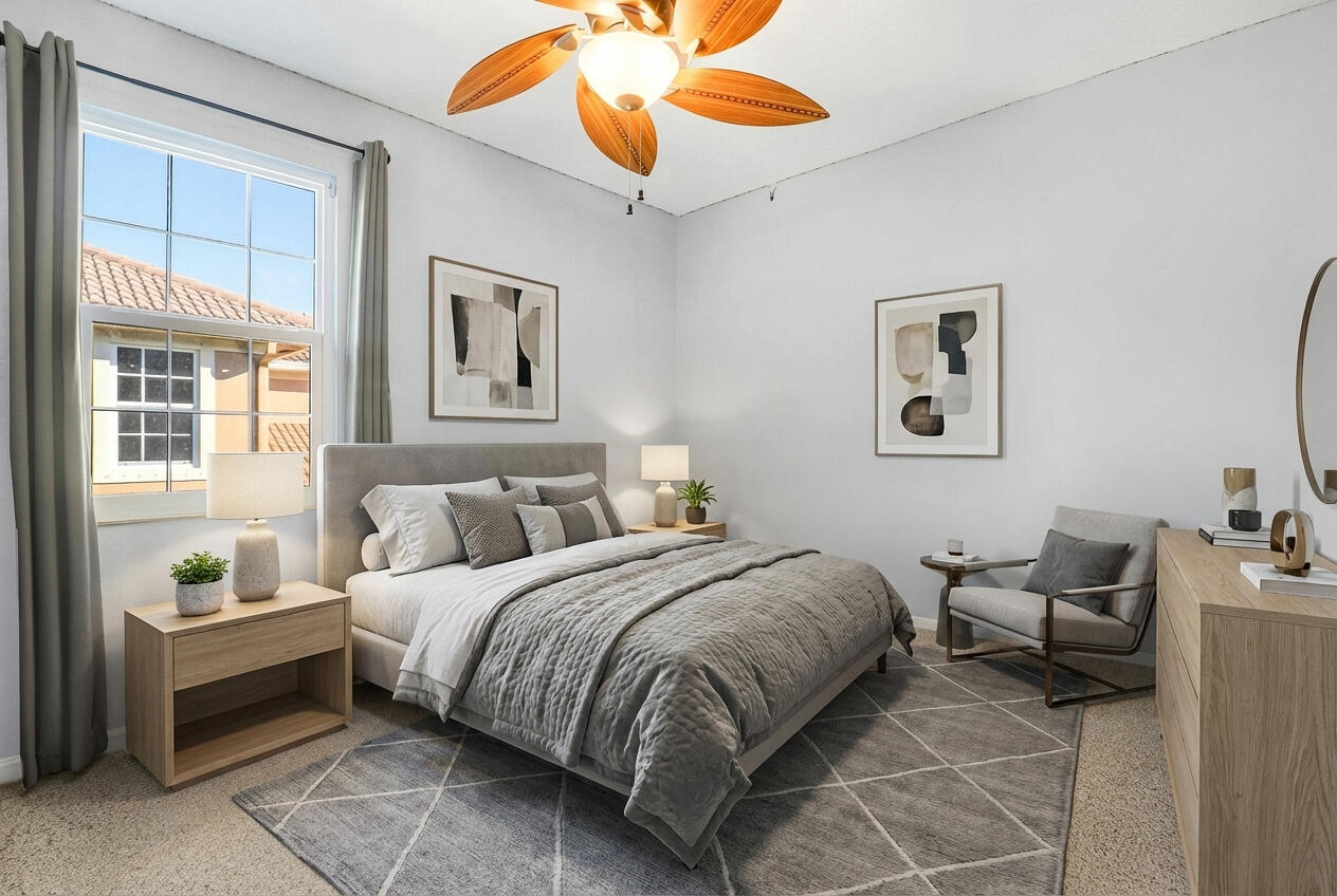 104 Via Azurra Jupiter, FL 33458 - Photo 38 of 41 a bedroom with a bed and a chandelier