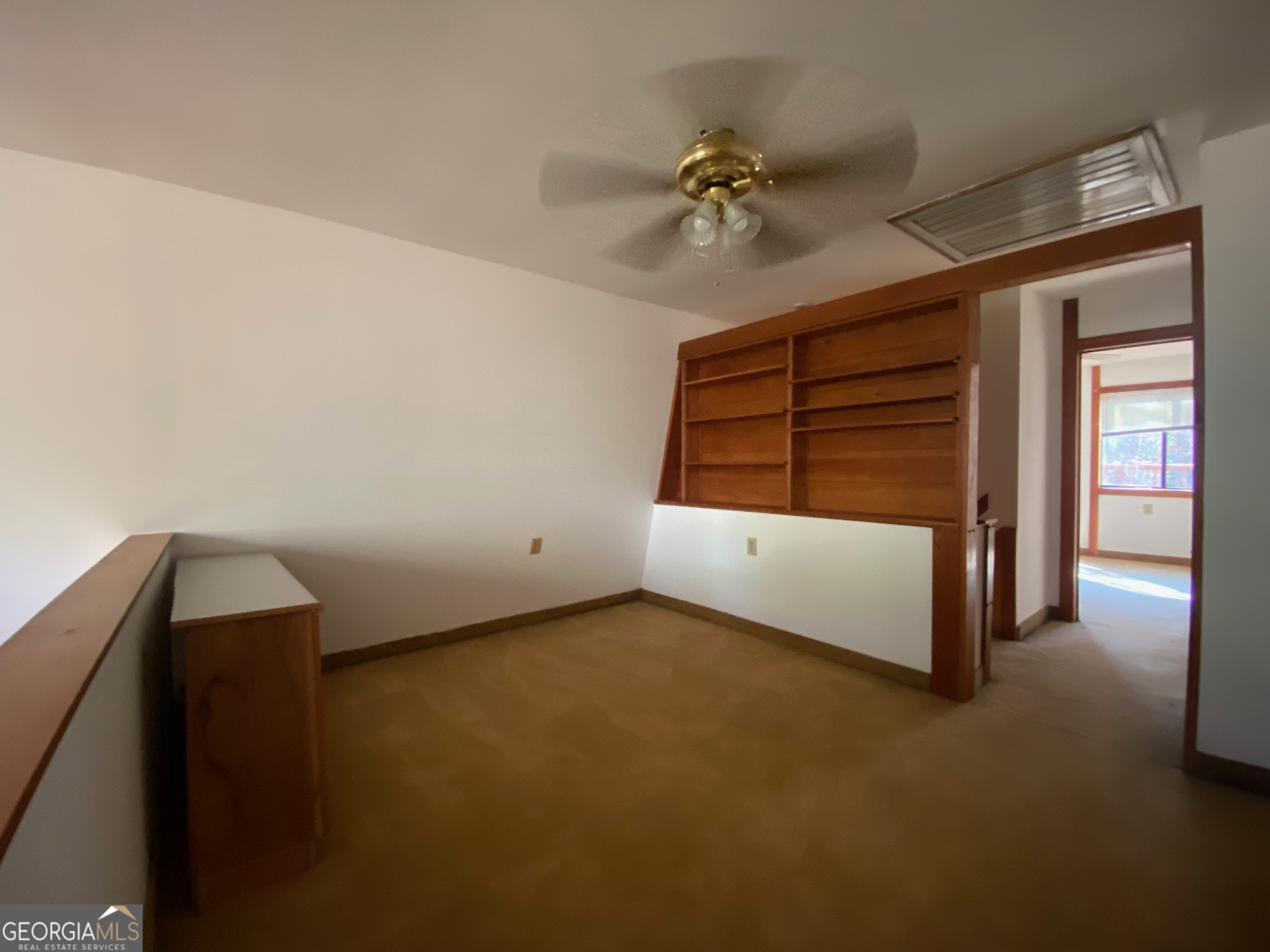 231 West Seminole Drive Byron, GA 31008 - Photo 14 of 38 a bedroom with a bed and a chandelier fan