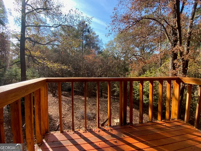 a view of a house with large tree