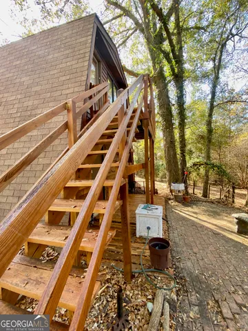 a view of a balcony with chairs