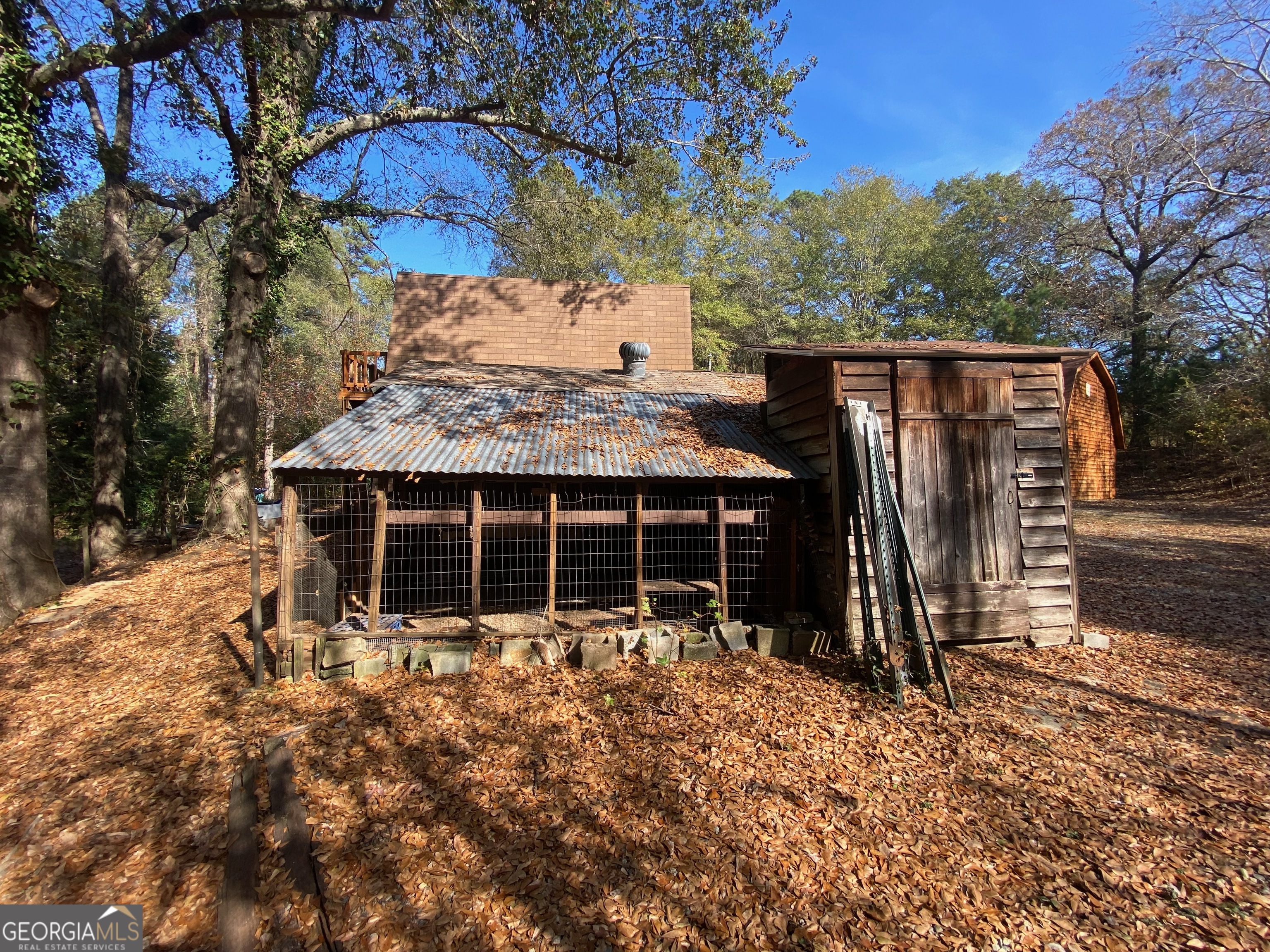 231 West Seminole Drive Byron, GA 31008 - Photo 27 of 38 a view of a house with a yard and wooden fence