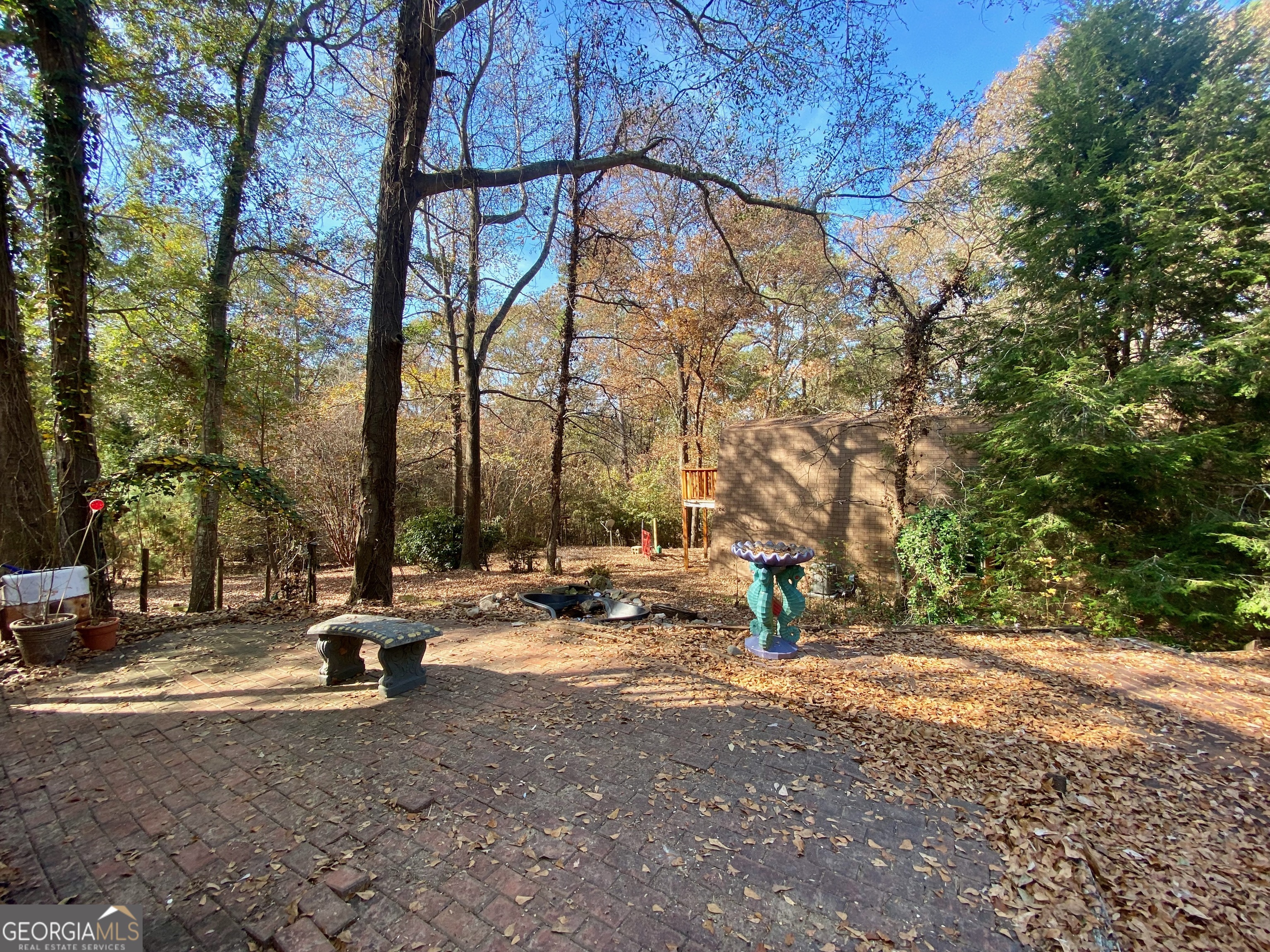 231 West Seminole Drive Byron, GA 31008 - Photo 32 of 38 a ground with lots of tall trees