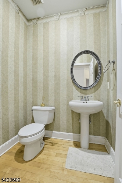 29 Pine Valley Road Livingston, NJ 07039 - Photo 13 of 30 a bathroom with a toilet a sink and a mirror