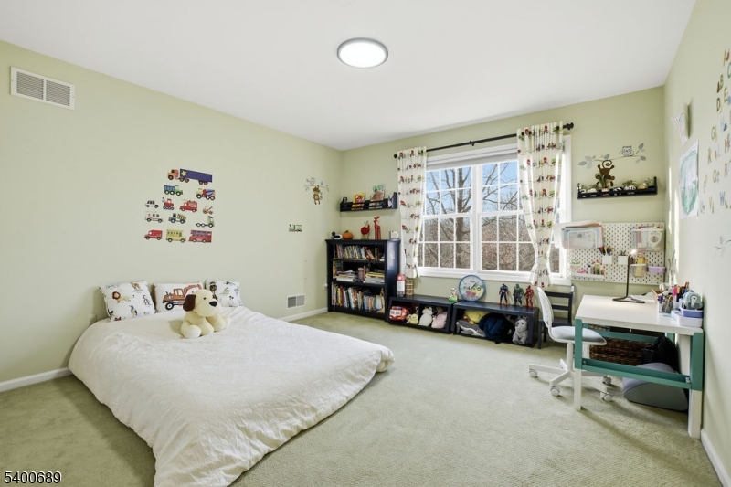 29 Pine Valley Road Livingston, NJ 07039 - Photo 18 of 30 a bedroom with a bed and a large window