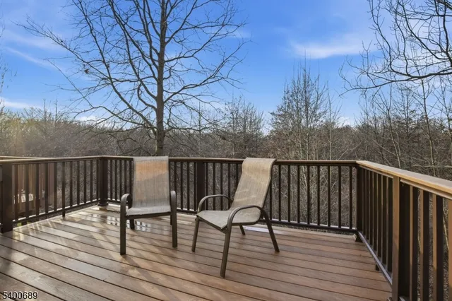a view of deck with wooden floor and outdoor seating
