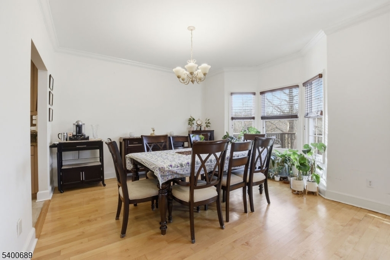 29 Pine Valley Road Livingston, NJ 07039 - Photo 8 of 30 a view of a dining room with furniture and a chandelier
