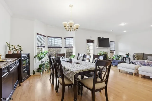 a view of a dining room with furniture and a kitchen