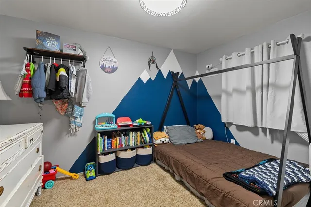 a bedroom with bed and a baby