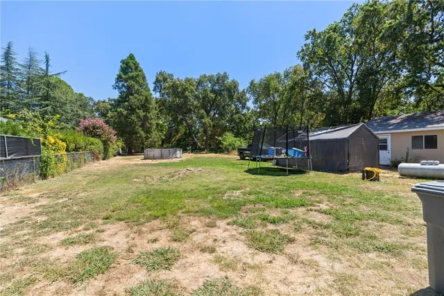 front view of a house with a yard and garage