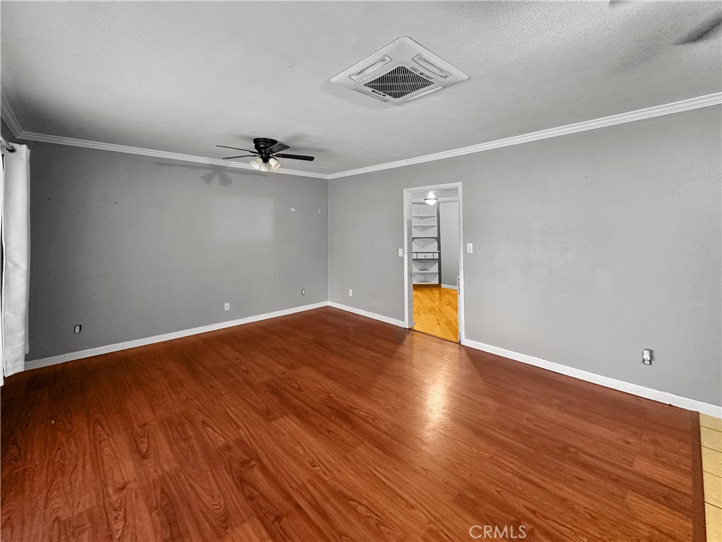 5150 Miners Ranch Road Oroville, CA 95966 - Photo 6 of 12 a view of empty room with wooden floor and fan