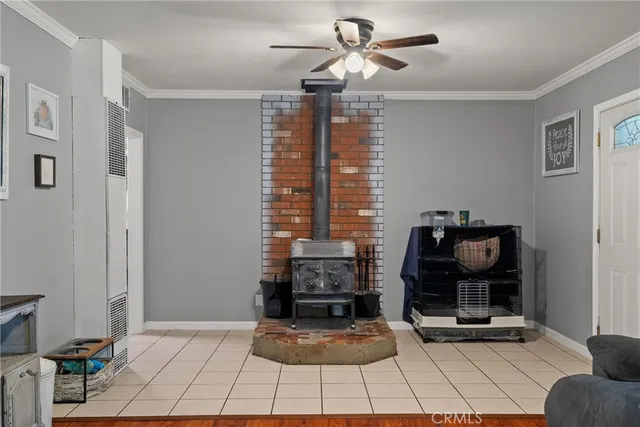 a living room with fireplace furniture and a window