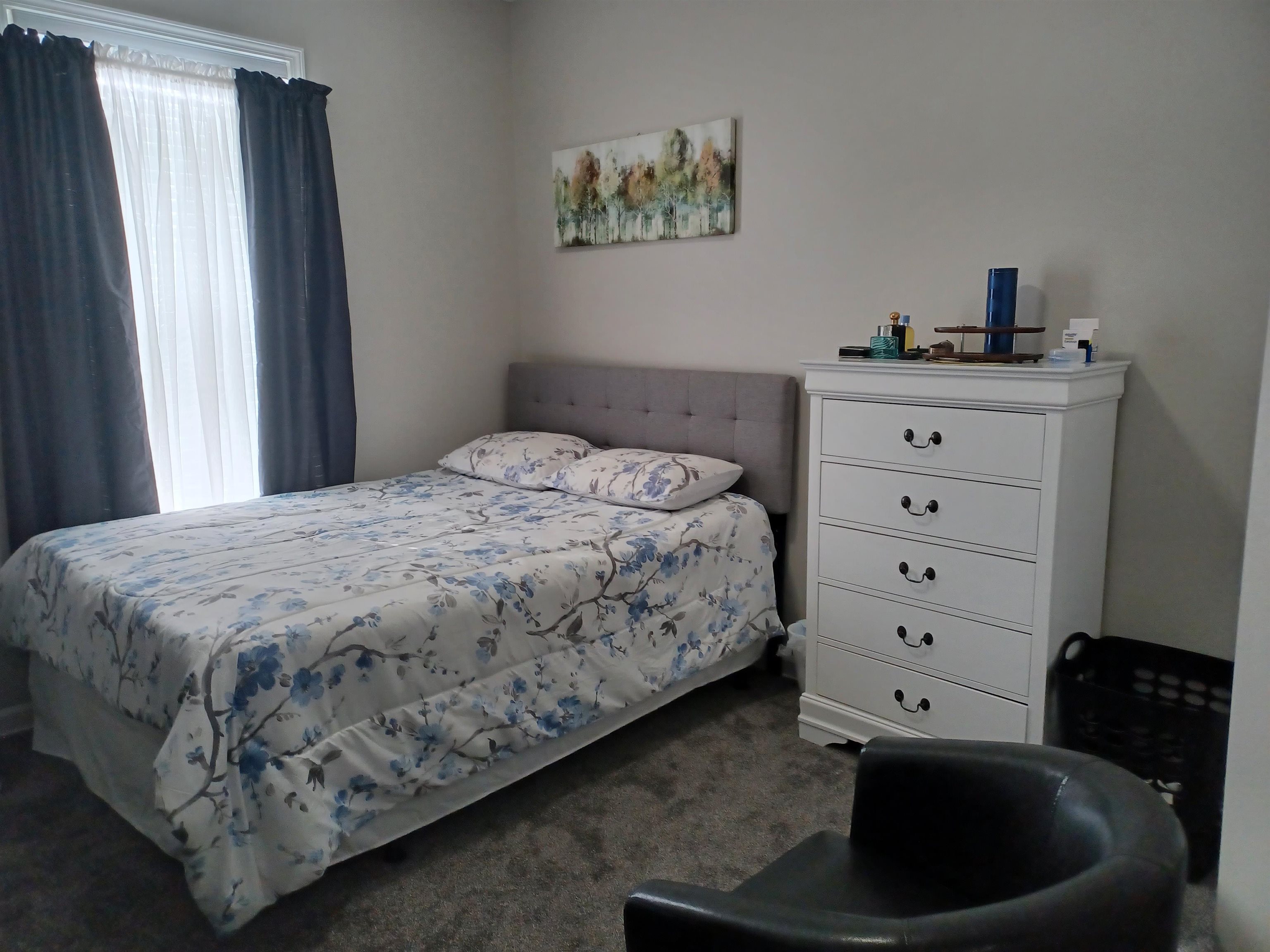 8700 Macon Road Memphis, TN 38018 - Photo 11 of 18 a bedroom with a bed and a dresser