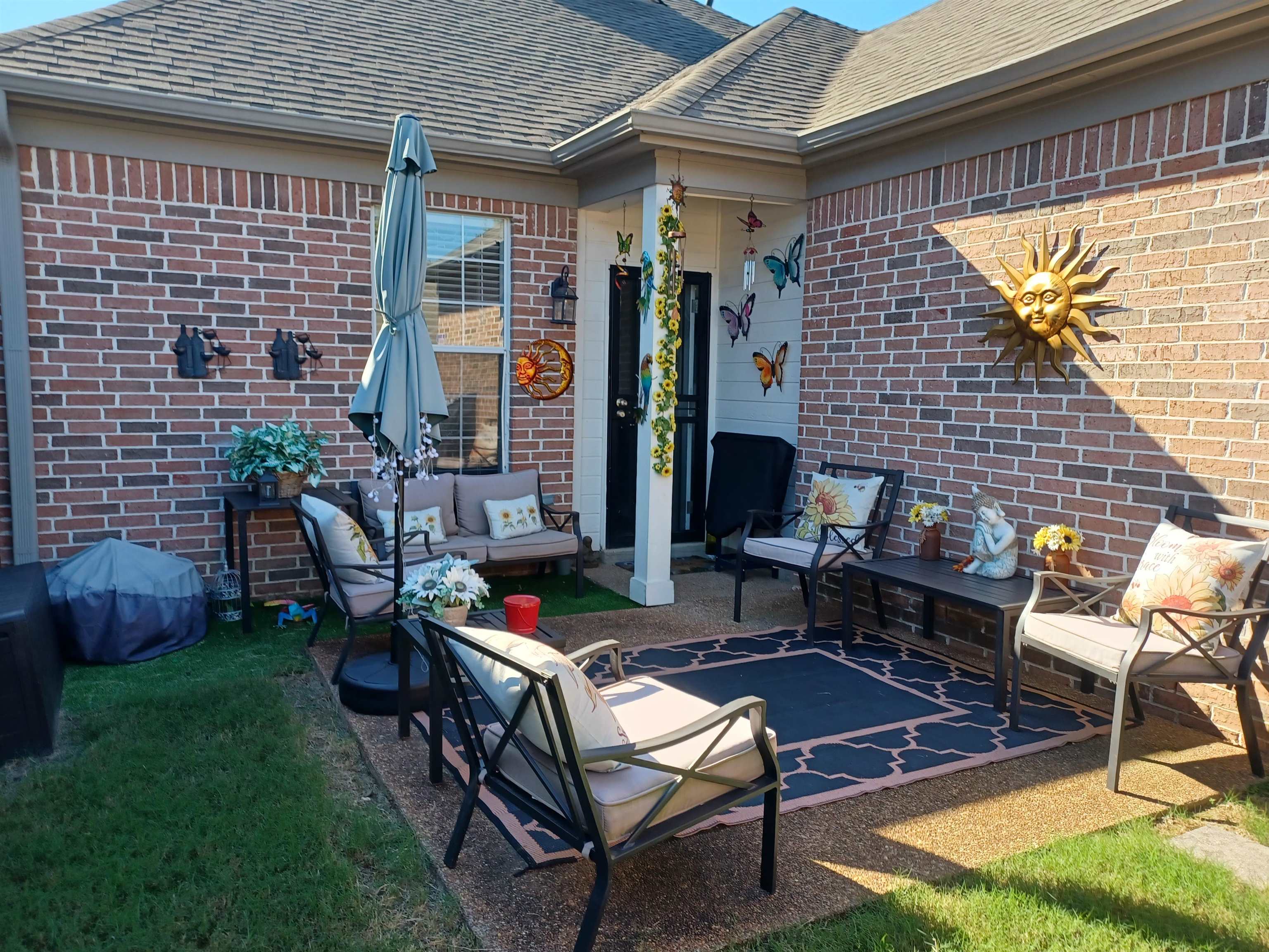 8700 Macon Road Memphis, TN 38018 - Photo 17 of 18 a backyard of a house with outdoor seating
