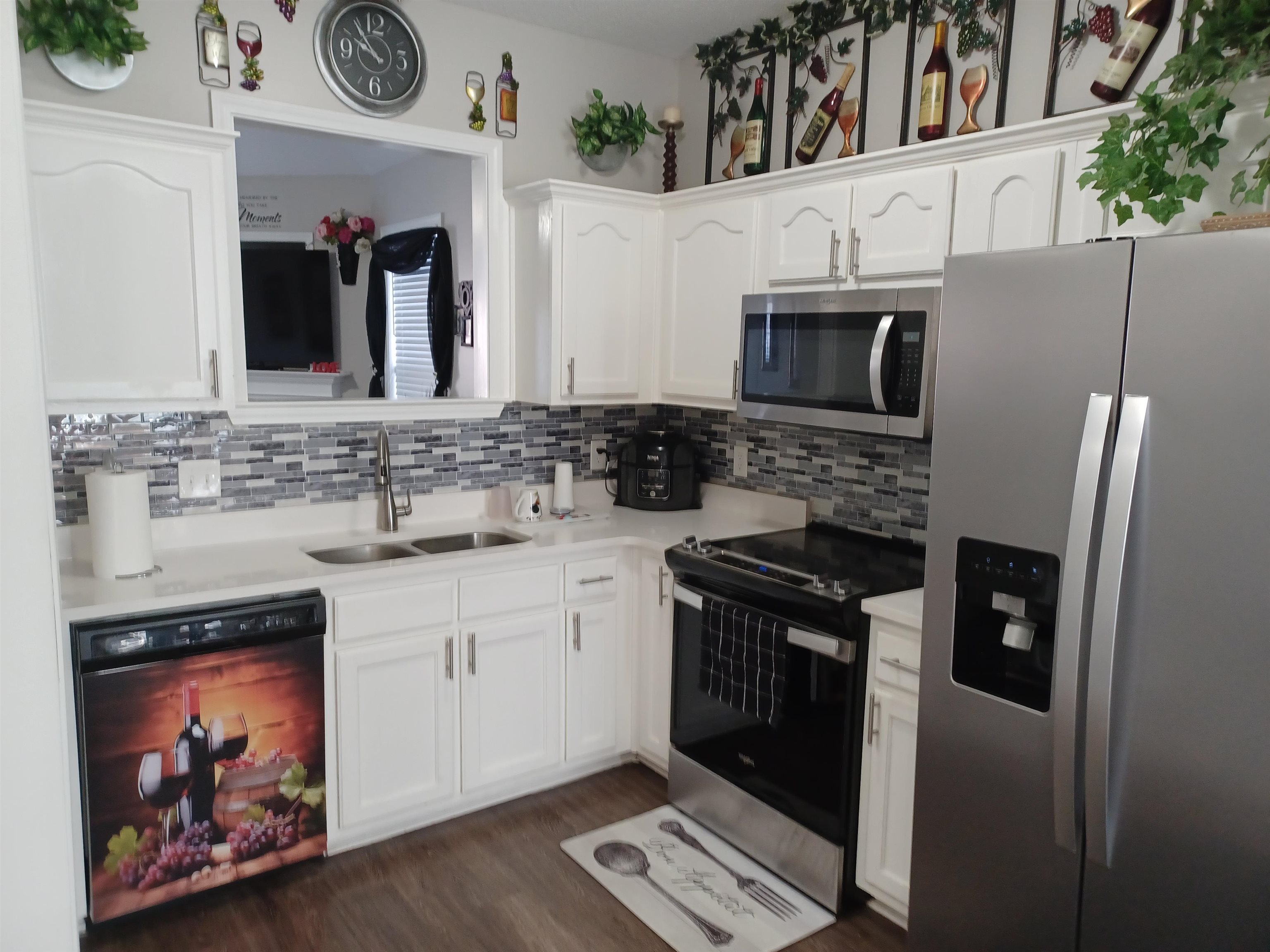 8700 Macon Road Memphis, TN 38018 - Photo 5 of 18 a kitchen with stainless steel appliances granite countertop a stove microwave and refrigerator