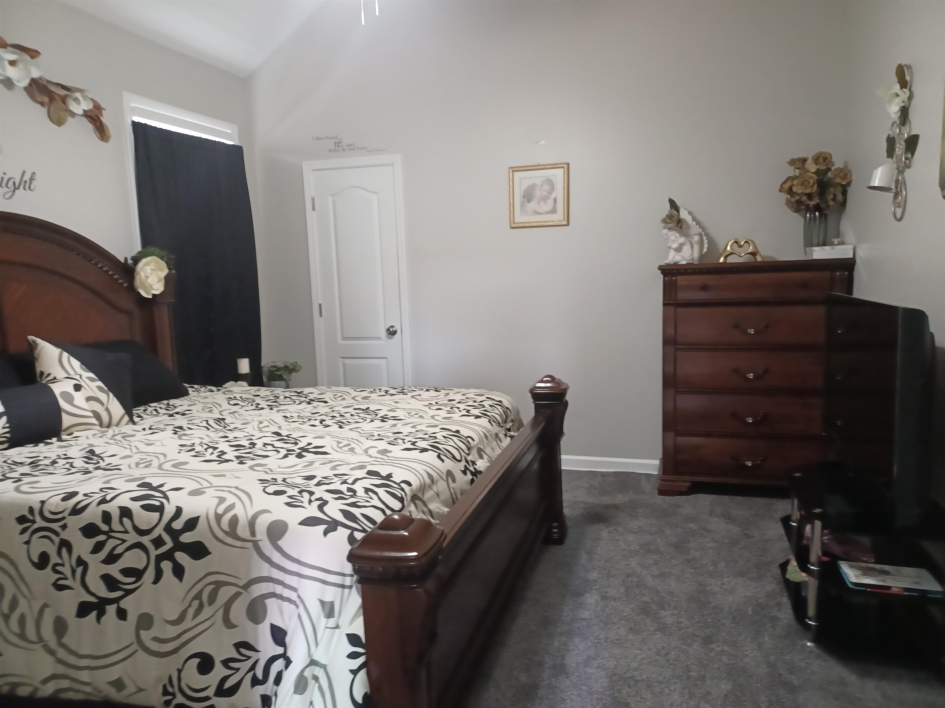 8700 Macon Road Memphis, TN 38018 - Photo 8 of 18 a bedroom with a bed and a dresser