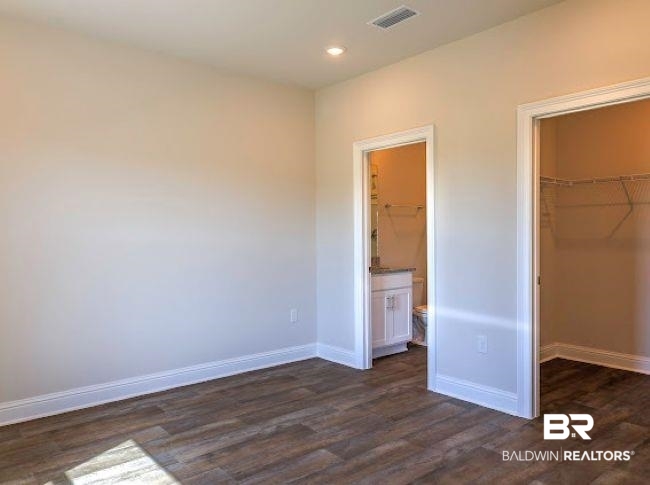 13791 Logan Place Foley, AL 36535 - Photo 12 of 25 Room featuring wood-finish flooring, recessed lighting, and a white baseboard trim
