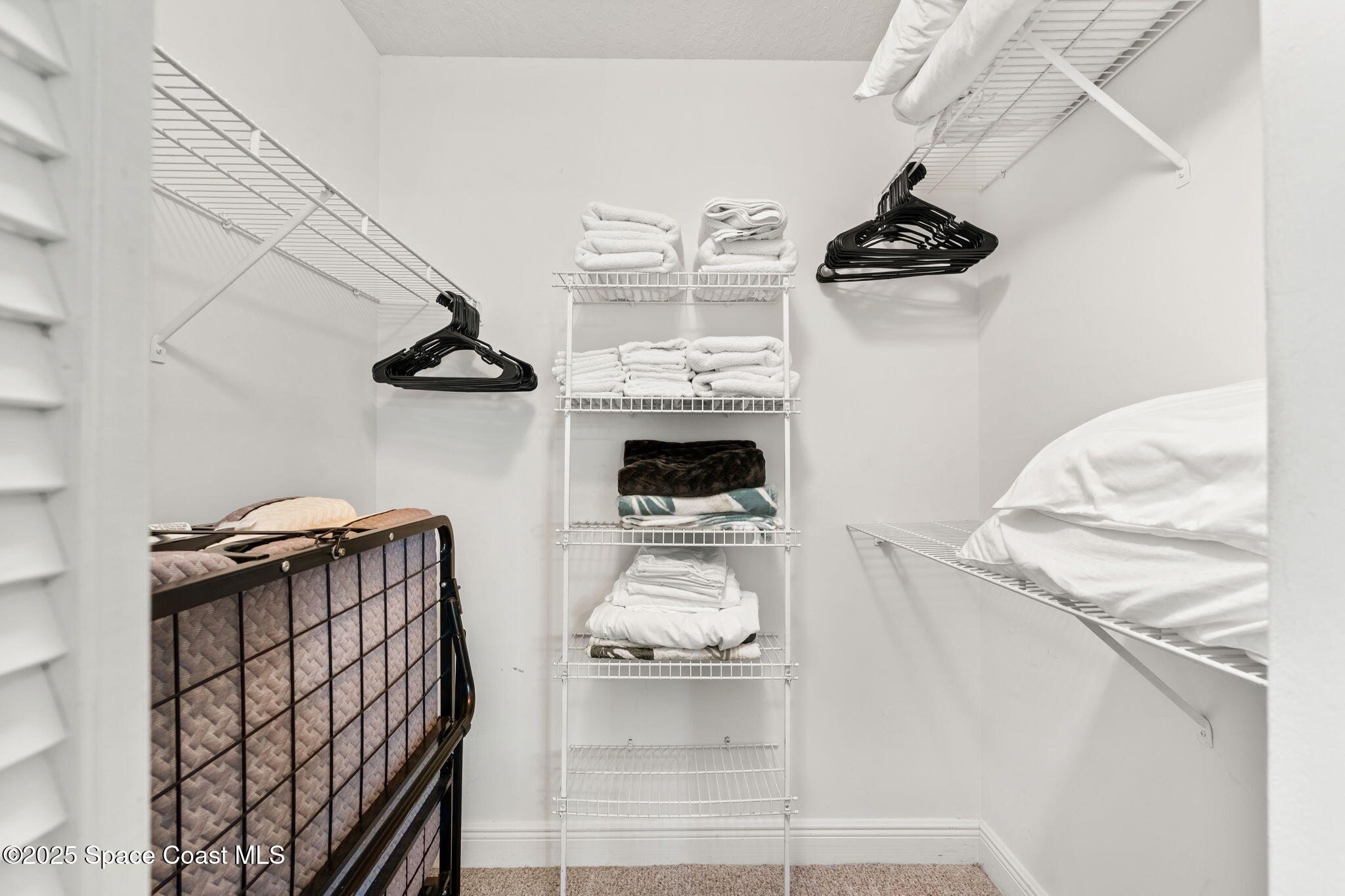 7667 North Wickham Road, Unit 518 Melbourne, FL 32940 - Photo 14 of 34 a view of hallway with washer and dryer