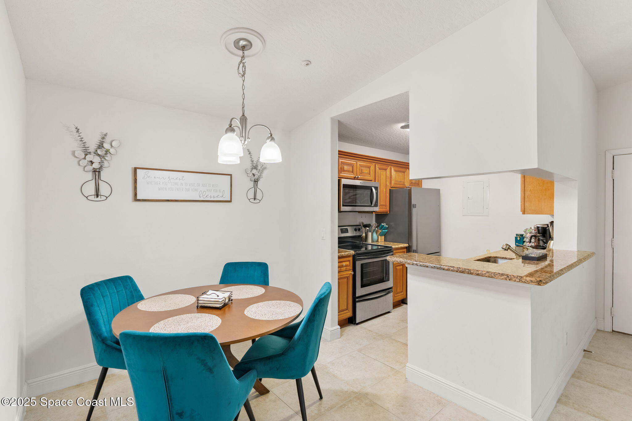 7667 North Wickham Road, Unit 518 Melbourne, FL 32940 - Photo 16 of 34 a dining room with furniture and window