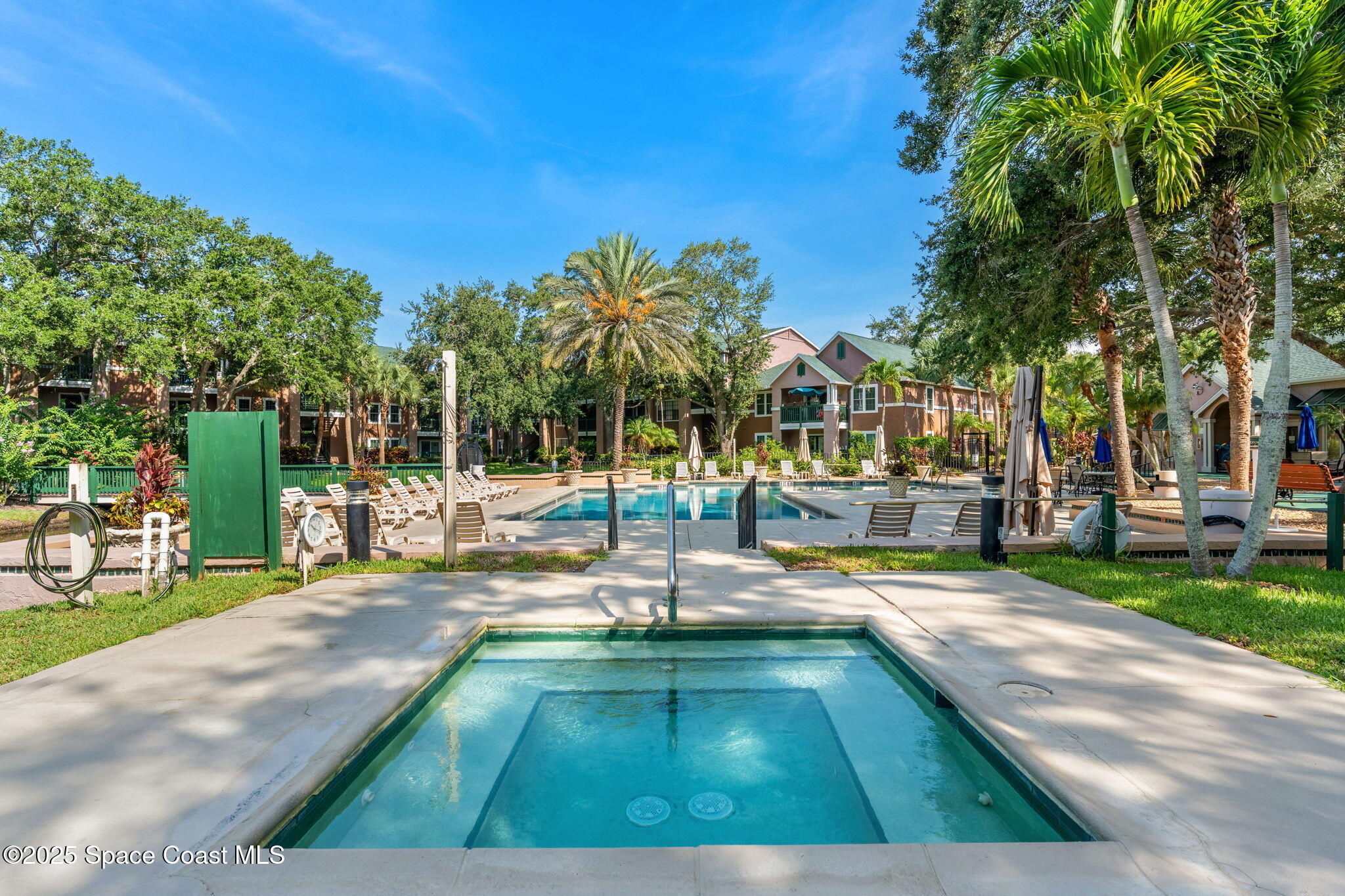 7667 North Wickham Road, Unit 518 Melbourne, FL 32940 - Photo 23 of 34 a view of a swimming pool with a patio