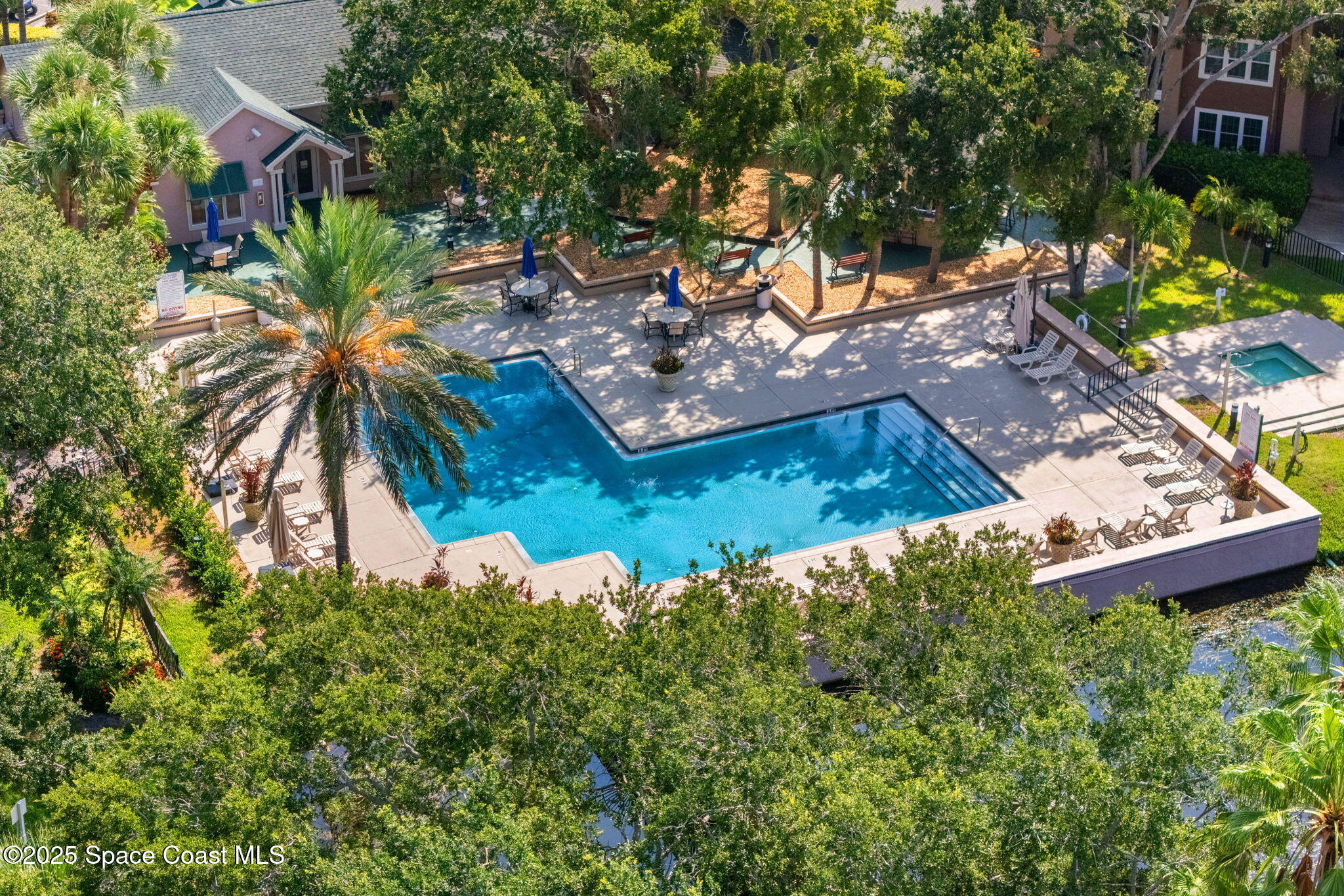 7667 North Wickham Road, Unit 518 Melbourne, FL 32940 - Photo 29 of 34 a view of a house with a yard