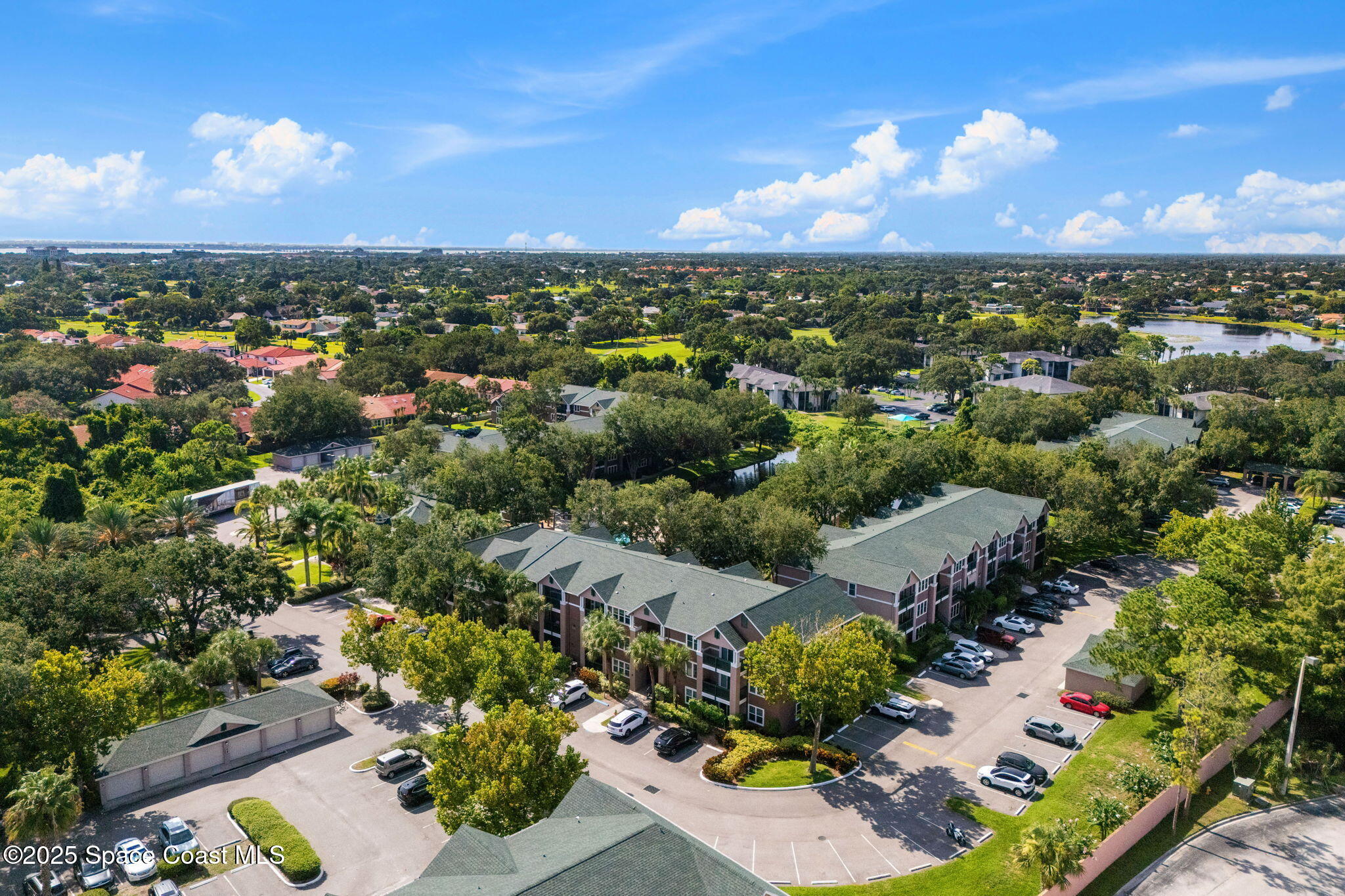 7667 North Wickham Road, Unit 518 Melbourne, FL 32940 - Photo 30 of 34 an aerial view of multiple house
