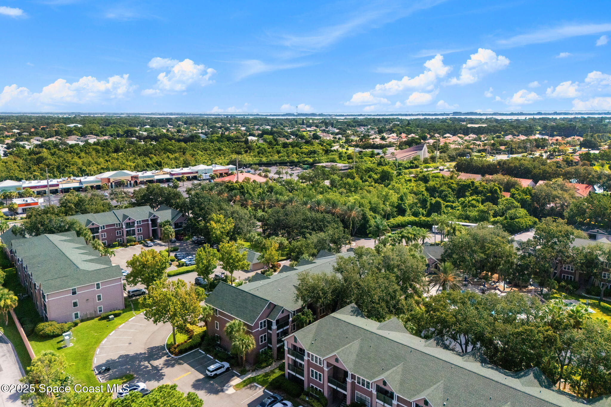 7667 North Wickham Road, Unit 518 Melbourne, FL 32940 - Photo 31 of 34 an aerial view of a city