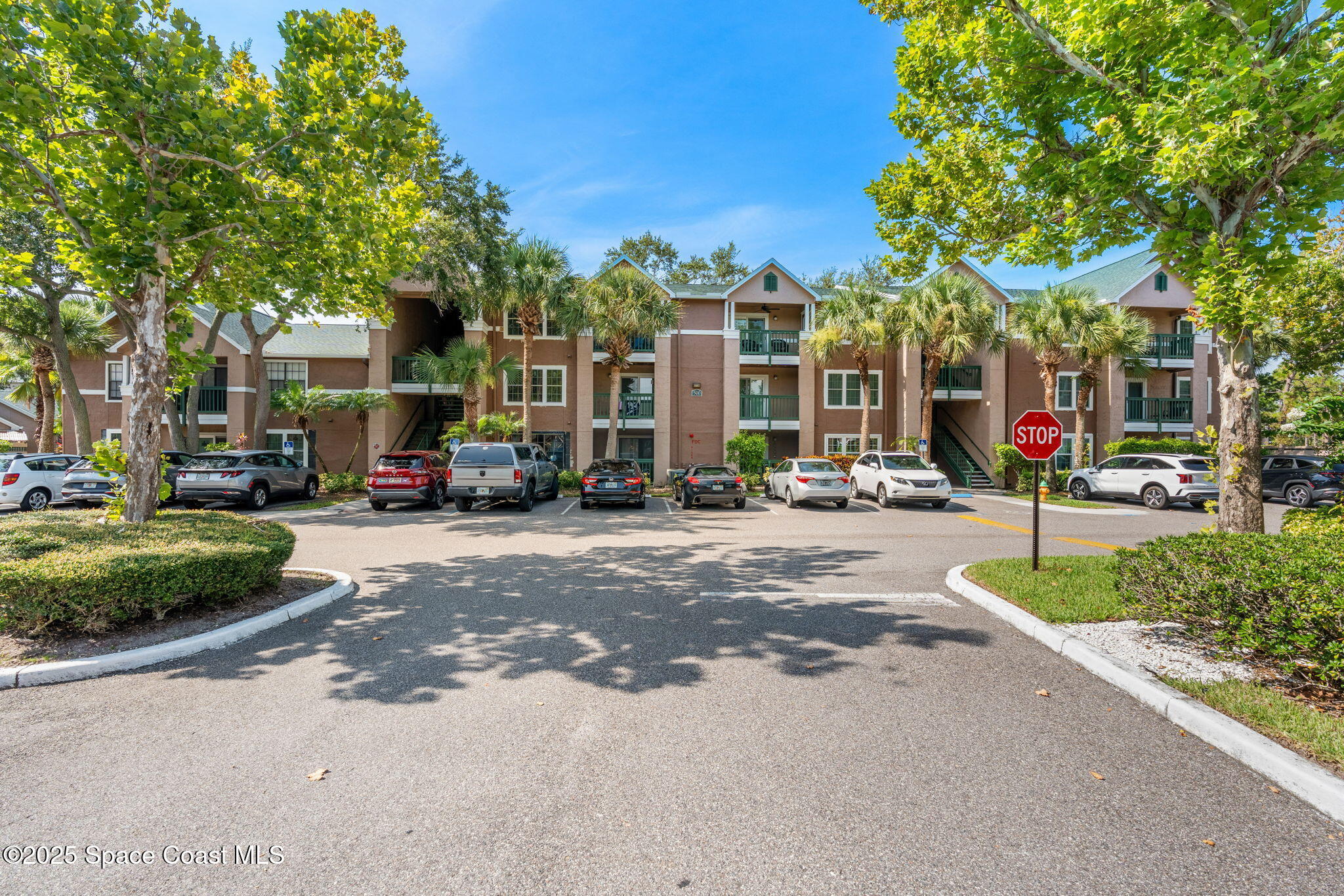 7667 North Wickham Road, Unit 518 Melbourne, FL 32940 - Photo 33 of 34 a view of a street with cars