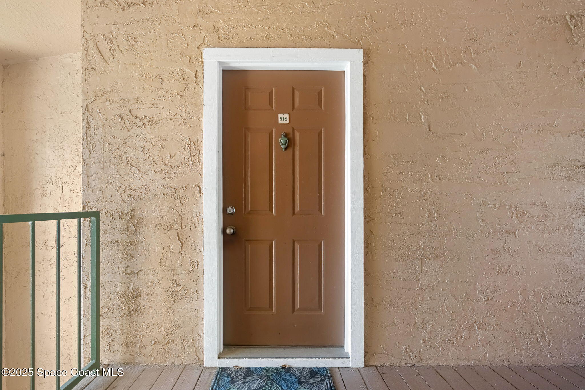 7667 North Wickham Road, Unit 518 Melbourne, FL 32940 - Photo 6 of 34 view of a hallway with wooden floor