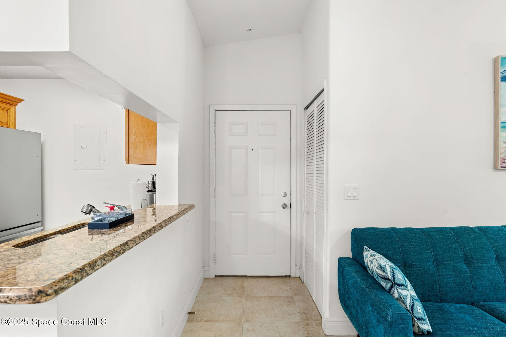 7667 North Wickham Road, Unit 518 Melbourne, FL 32940 - Photo 7 of 34 a hallway with a couch