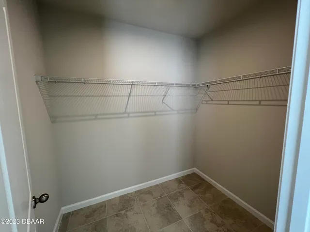 a view of a room with racks on the wall