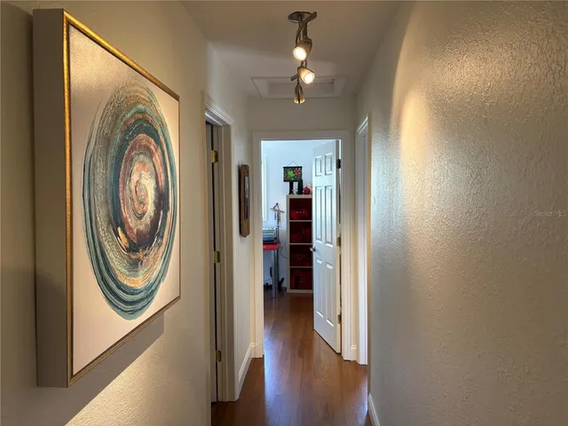 a view of a hallway with washer and dryer
