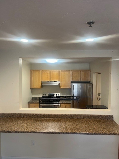 17 Federal Street, Unit 210 Worcester, MA 01608 - Photo 3 of 8 a kitchen with stainless steel appliances granite countertop a sink stove and cabinets
