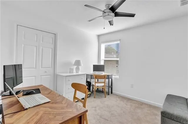a workspace with furniture and a window