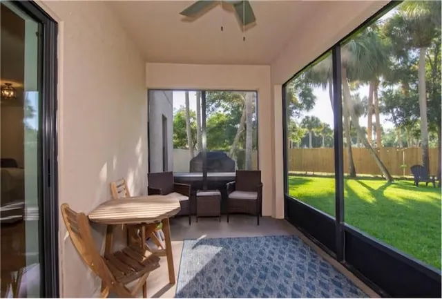 a living room with furniture and a garden