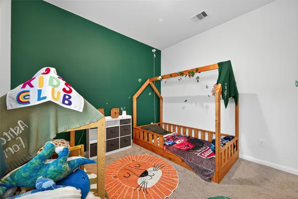 a bedroom with a bed and walk in closet