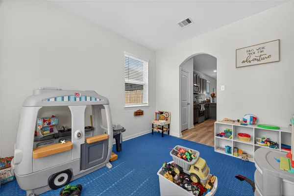 a room with furniture and toys
