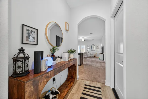 a view of living room kitchen and entryway