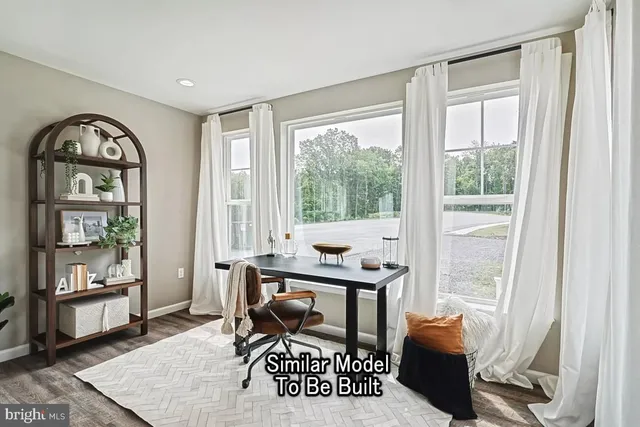 a view of a livingroom with furniture and a window