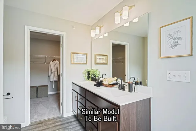 a bathroom with a sink a mirror and a toilet