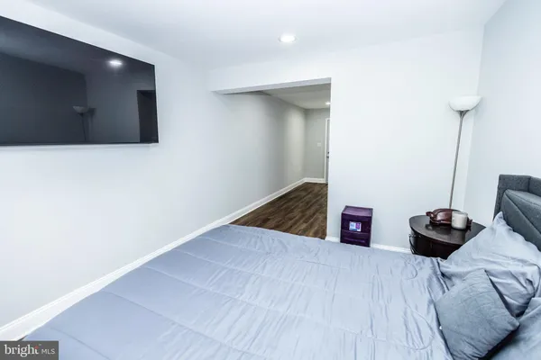 a view of empty room with furniture and wooden floor