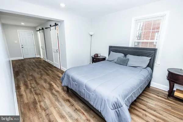 a bedroom with bed and a window