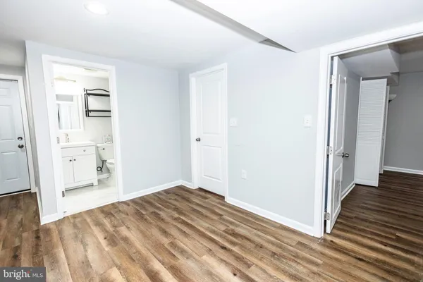 a view of a room with wooden floor and closet
