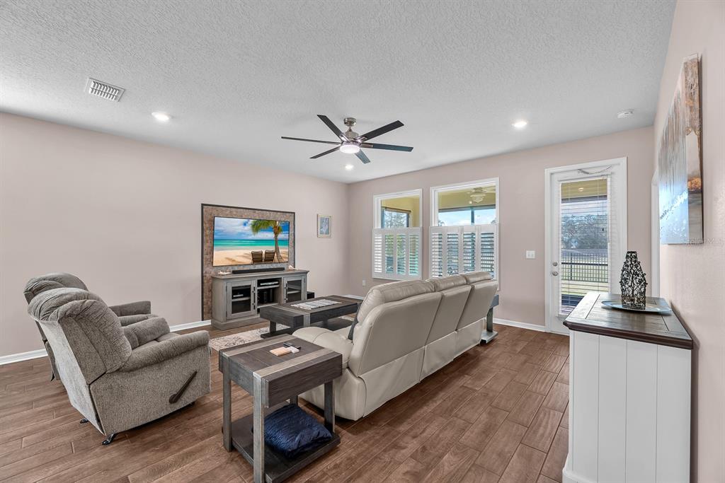 6230 Plover Meadow Street Lithia, FL 33547 - Photo 18 of 50 a living room with furniture and a large window